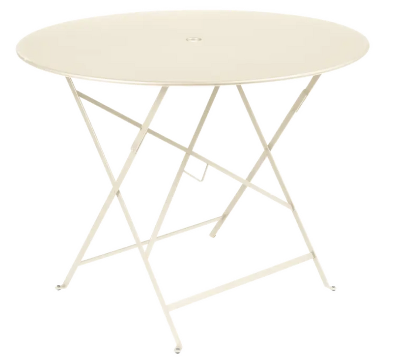 Load image into Gallery viewer, Latte beige Fermob round bistro table with a metal top and parasol hole, ideal for outdoor restaurant or patio settings.
