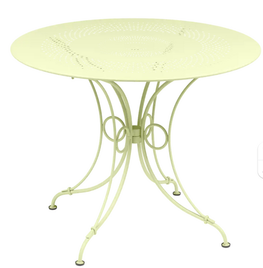 Fermob 1900 outdoor table with 96cm diameter, round metal design for patio or garden seating.