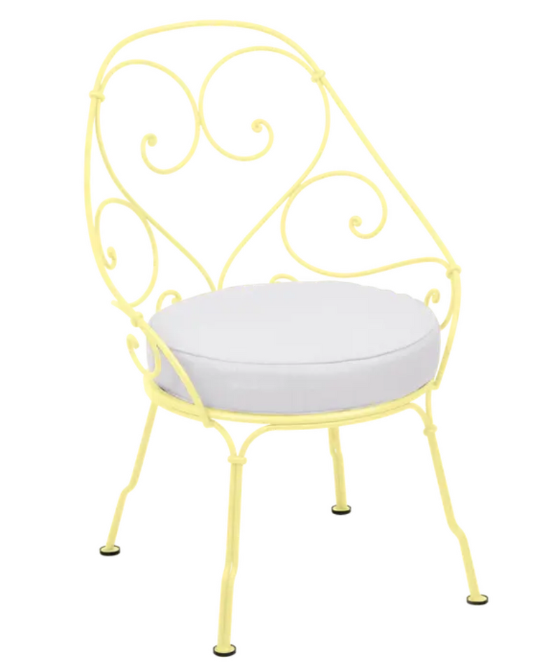 Load image into Gallery viewer, Lemon off-white Fermob Cabriolet outdoor armchair with metal frame and fabric seat, stylish garden or patio furniture.
