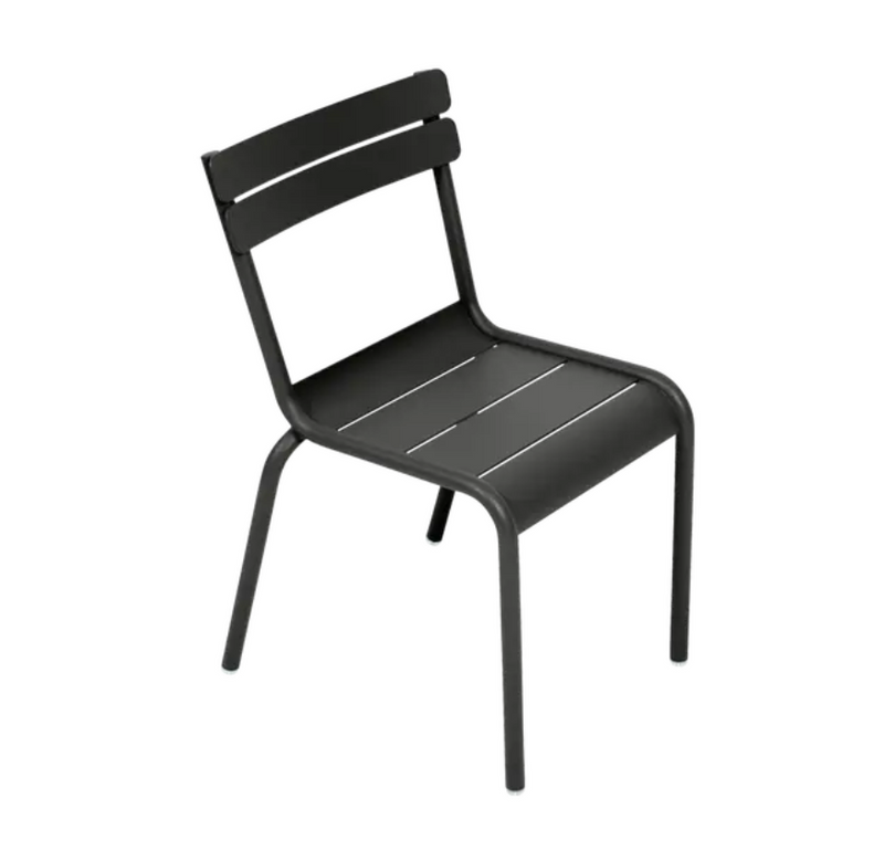 Load image into Gallery viewer, Fermob Luxembourg Kid Chair in vibrant yellow, designed for children's corner or restaurant settings with colorful, durable plastic.
