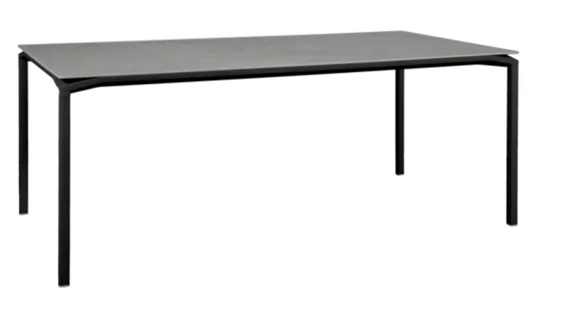 Load image into Gallery viewer, Fermob CALVI Kreta mineral dining table, 195x95 cm, eight-seater with liquorice-colored concrete tabletop for outdoor dining.
