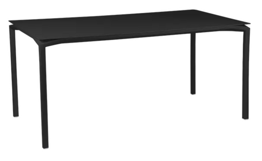 Fermob CALVI rectangular kitchen table, 160x80 cm, six-seater with liquorice finish, shown with chairs in a modern dining setting.