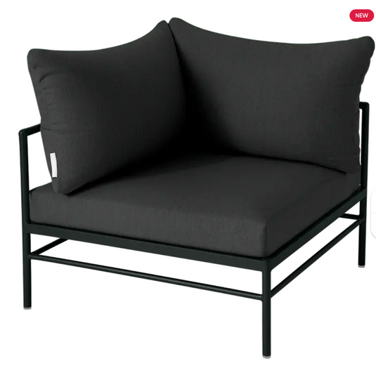 Fermob Rivage corner outdoor armchair in Liquorice Night Grey, metal frame with plush cushions for comfortable seating.
