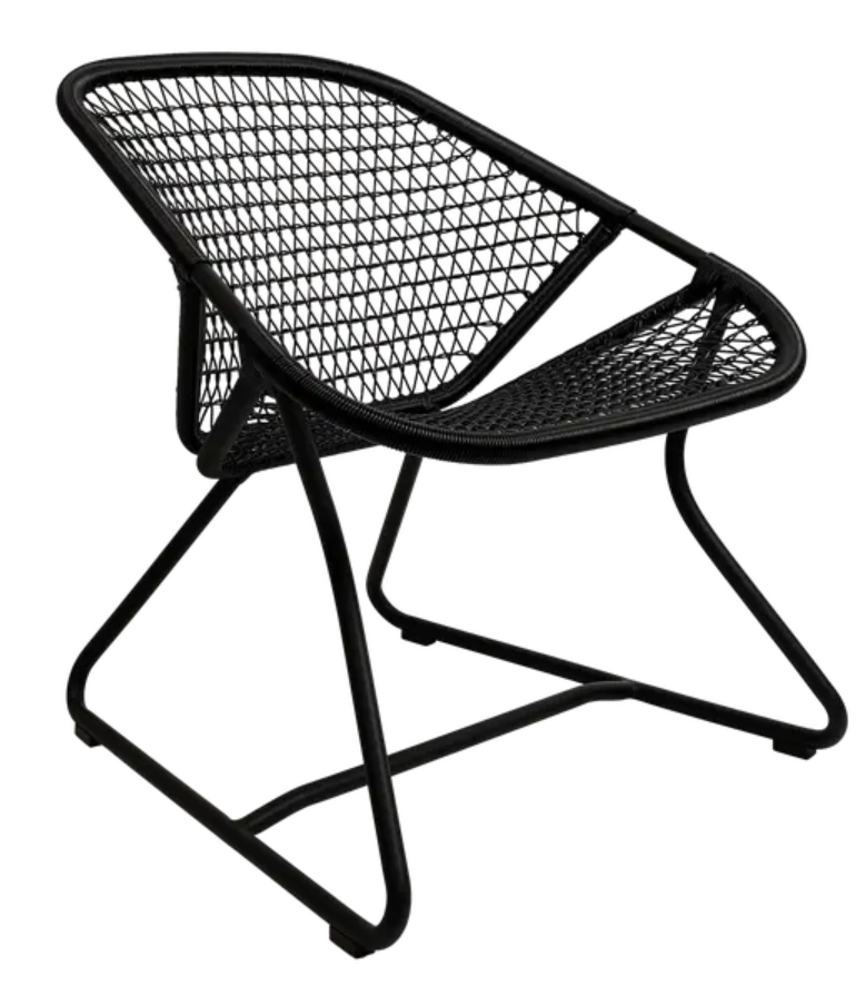 Woven Fermob Sixties Low Armchair lounge chair with Liquorice color, stylish modern furniture for restaurant or living space.