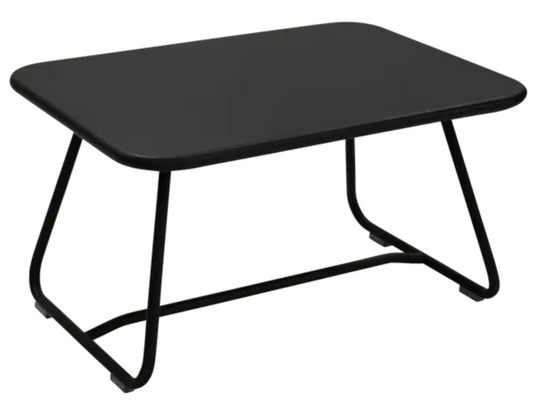 Fermob Sixties low outdoor table in Liquorice color, 76 x 55.5cm, with a sleek round design for garden or patio use.