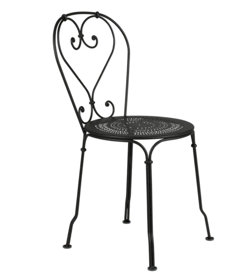 Load image into Gallery viewer, Fermob Liquorice 1900 outdoor chair with a sleek metal frame and curved armrests, designed for garden or patio use.
