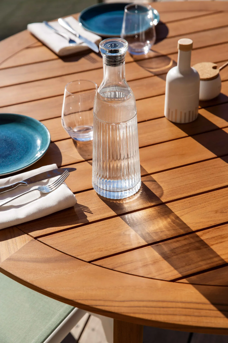 Load image into Gallery viewer, Fermob Teak Round Outdoor Table with 120cm diameter, natural teak wood, suitable for garden or patio settings.
