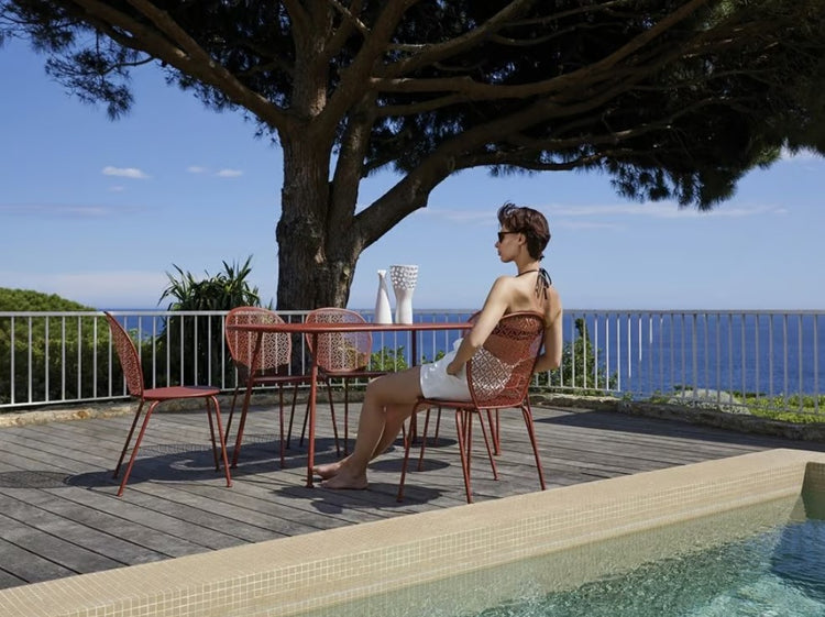 Fermob Lorette Oval Metal Table, 160x90 cm, with a sleek outdoor design suitable for hospitality settings.