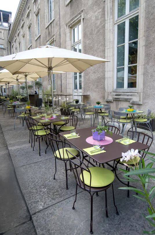 Fermob Louvre outdoor chair with a sleek, modern design in vibrant color, ideal for garden or patio seating.