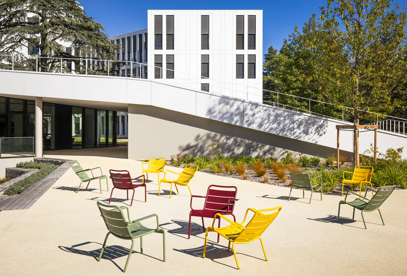 Load image into Gallery viewer, Fermob Luxembourg garden armchair lounge with metal frame and woven seat, ideal for outdoor patio or garden relaxation.
