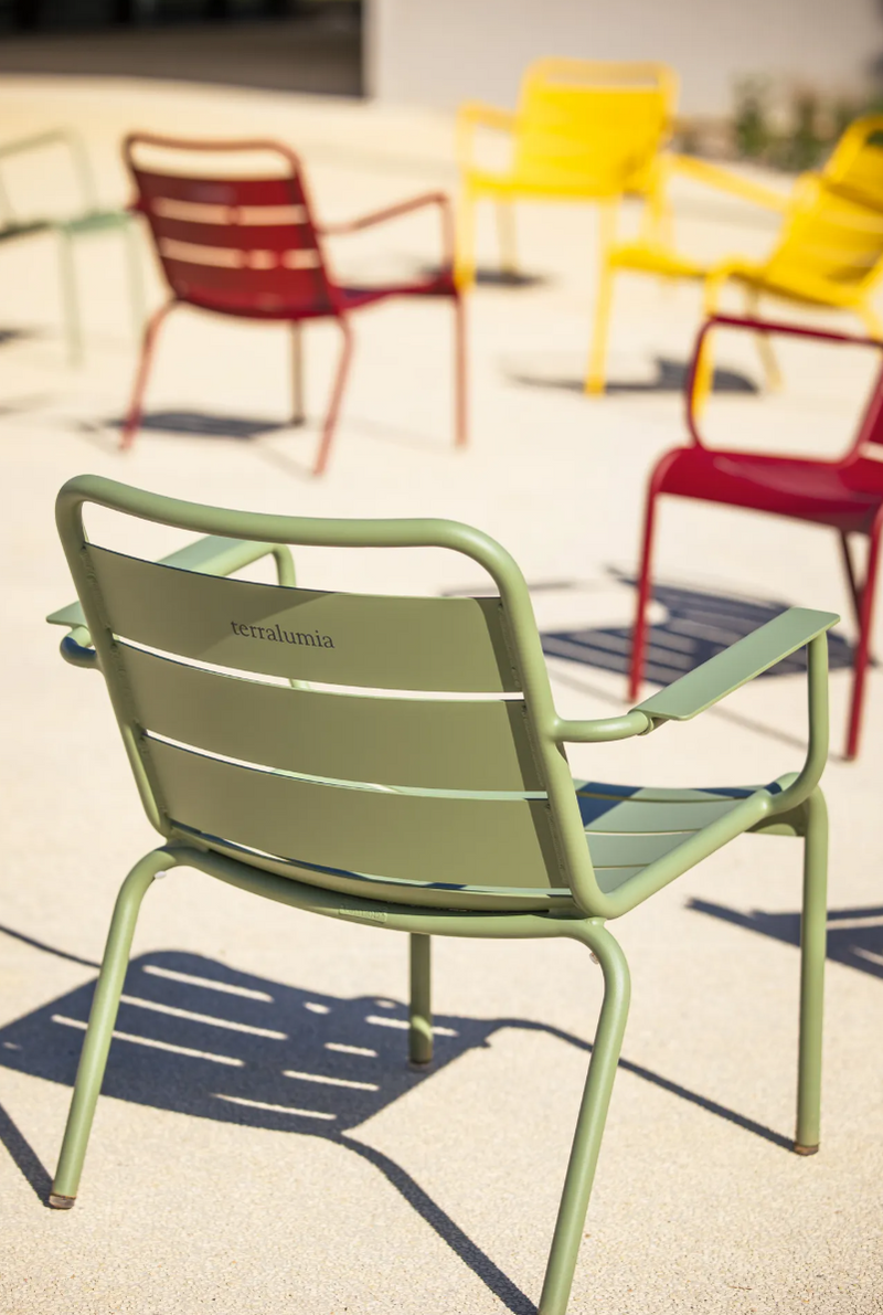 Load image into Gallery viewer, Fermob Luxembourg garden armchair lounge with a woven seat and metal frame, designed for outdoor patio or garden use.
