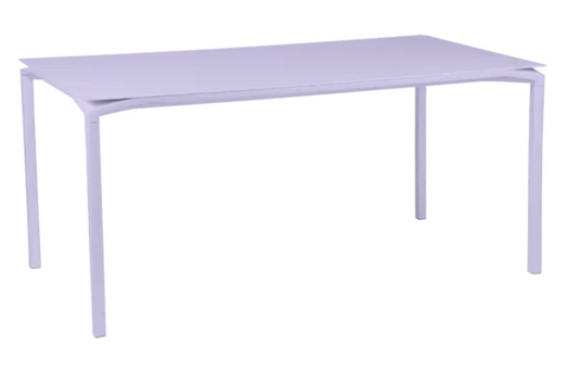 Fermob CALVI rectangular kitchen table, 160x80 cm, six-seater with a modern design, shown in a bright setting.