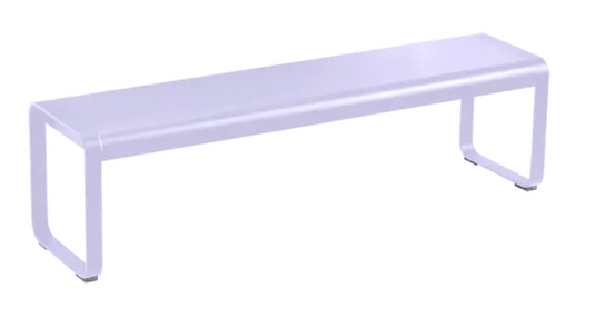 Fermob Bellevie outdoor bench with a sleek, modern design and smooth wooden seat, set outdoors on a garden patio.