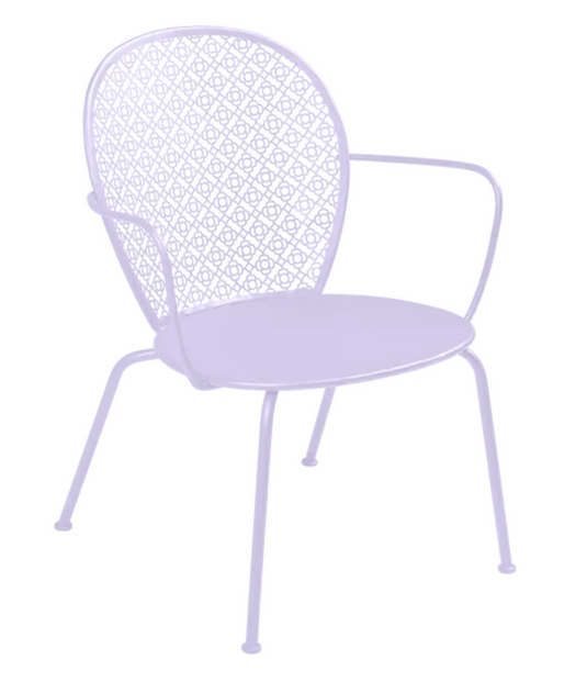 Fermob Lorette low metal armchair in marshmallow color with a curved backrest and slender legs, suitable for outdoor seating.