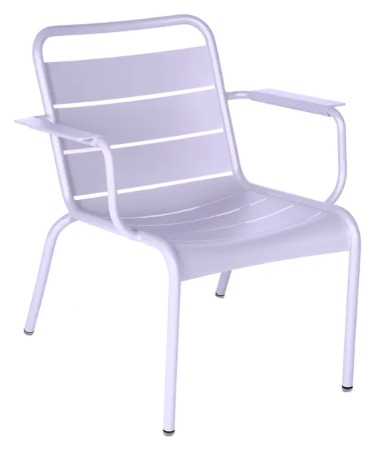Load image into Gallery viewer, Fermob Luxembourg garden armchair lounge with a sleek, curved design and cushioned seat in a modern outdoor setting.
