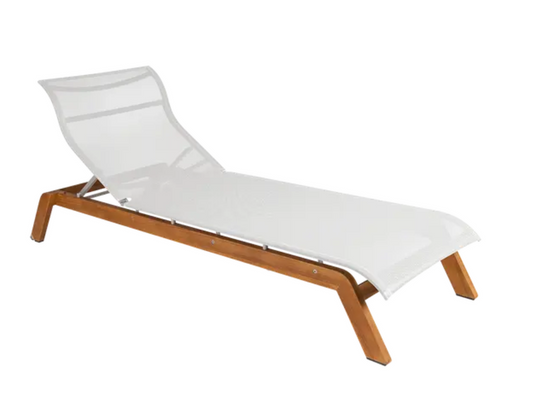 Fermob Maui teak sunlounger with slatted teak surface and sturdy base, ideal for outdoor relaxation on patios or gardens.