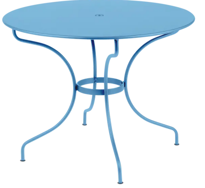 Load image into Gallery viewer, Fermob OPÉRA+ outdoor metal table in Maya Blue, 96 cm diameter, suitable for five-seater patio dining.
