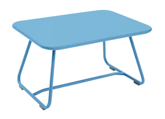 Maya Blue Fermob Sixties low outdoor table measuring 76x55.5cm, suitable for patio or garden use.