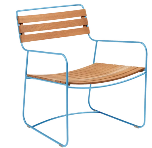 MayaBlue Surprising Teak Low Armchair by Fermob, outdoor metal chair with a sleek design and low armrests.