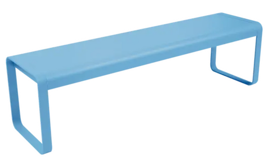 Blue Fermob Bellevie outdoor bench with curved metal legs and slatted seat, ideal for garden or patio seating.