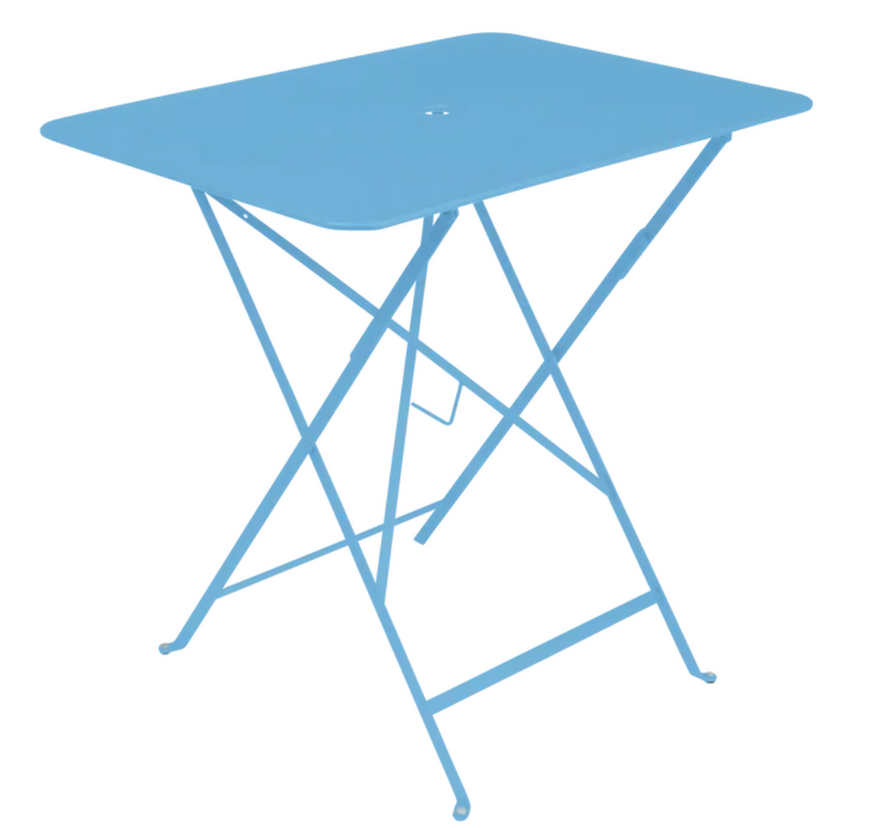 Load image into Gallery viewer, Fermob Maya Blue foldable bistro table, 77 x 57 cm, metal outdoor furniture, shown set up for outdoor dining or patio use.
