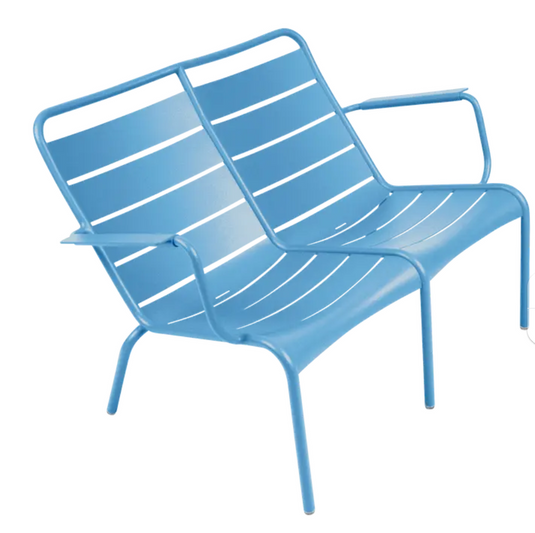 Blue Luxembourg Duo Low Armchair by Fermob, part of Fermb Kids Corner Contract Bench collection, showcasing modern outdoor furniture design.