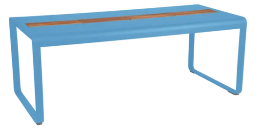 Bellevie outdoor dining table by Fermob, 196x90cm wood and metal table with storage, blue finish, eight seats.