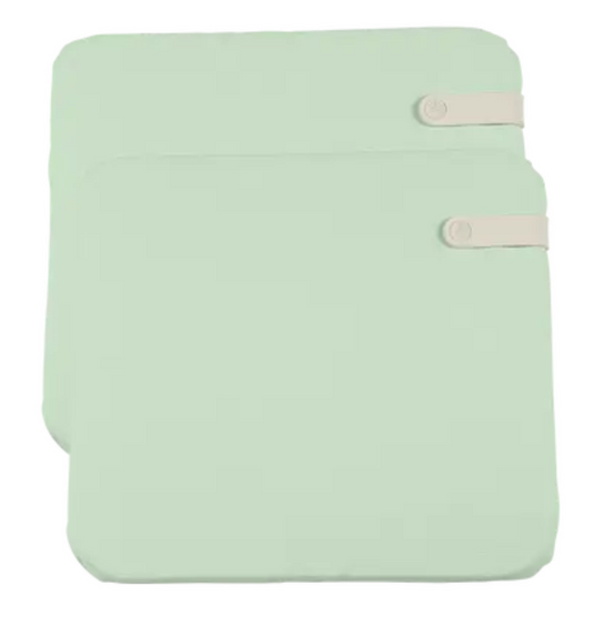 Set of two Fermob outdoor cushions in mint green and colorful patterns, 41 x 45 cm, designed for outdoor chairs.