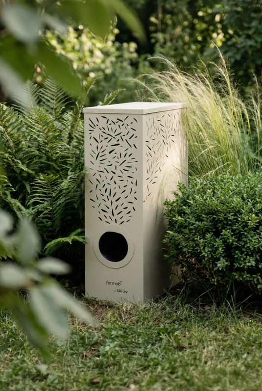 Fermob MOJO Anti-Mosquito Station for mosquito control, shown as a sleek outdoor device in a garden setting.