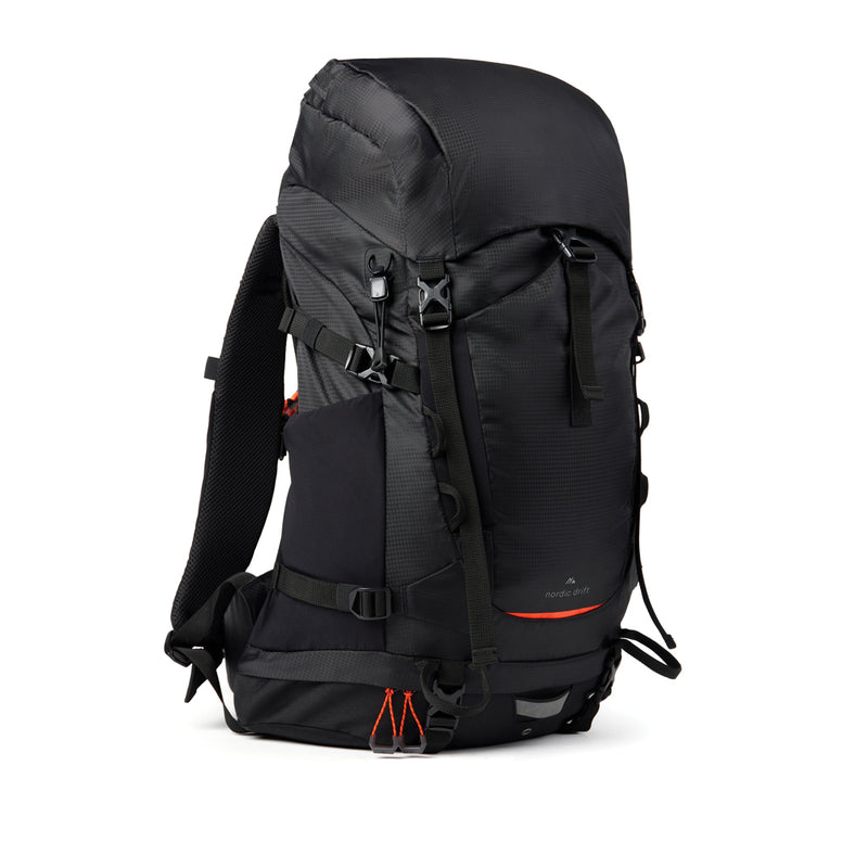 Load image into Gallery viewer, Nordic Drift Trail RCS 33L backpack in black, featuring multiple compartments and ergonomic straps for travel and everyday use.
