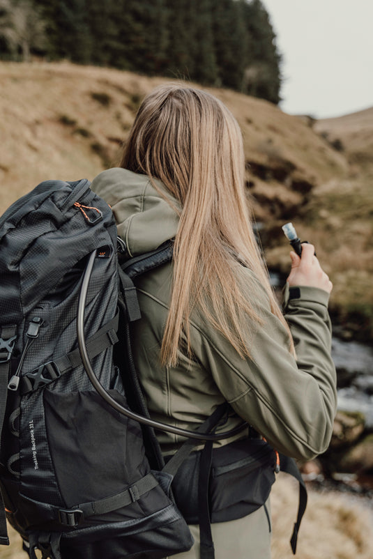 Nordic Drift Drift Trail RCS 33L backpack with multiple compartments, black color, and padded shoulder straps for travel and daily use.