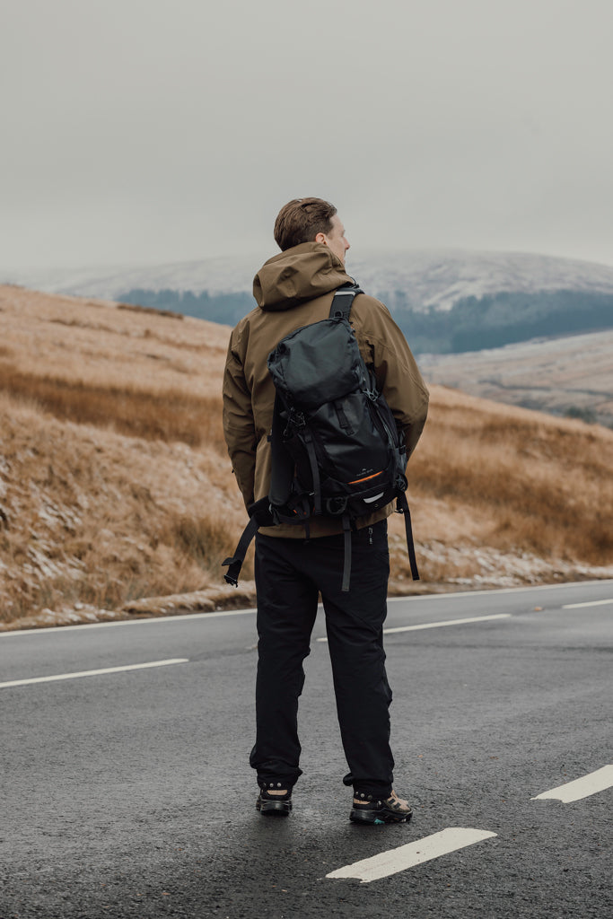 Load image into Gallery viewer, Nordic Drift Trail RCS 33L backpack showing adjustable straps, multiple compartments, and durable black nylon material.
