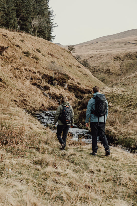 Nordic Drift Trail RCS 24L backpack in black with adjustable straps, designed for travel and outdoor adventures