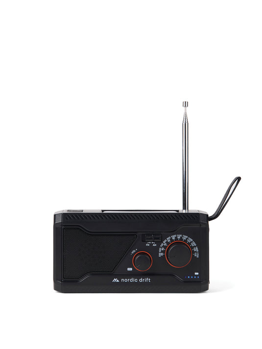 Nordic Drift Titan IPX4 multifunctional radio with 4000mAh battery, compact audio device featuring buttons and display on black background.
