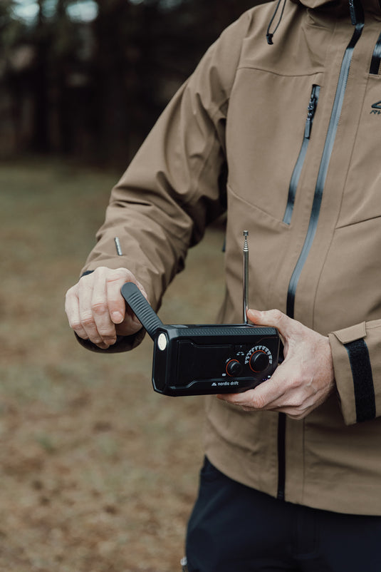 Nordic Drift Titan IPX4 multifunctional radio with 4000mAh battery, shown with buttons and display on a white background.