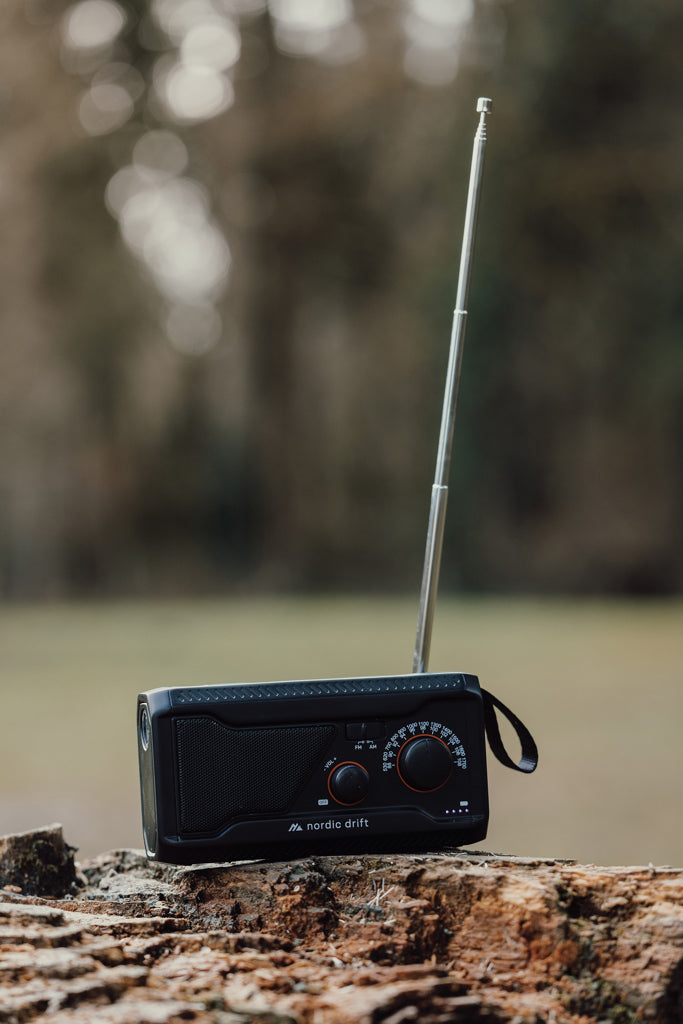 Load image into Gallery viewer, Nordic Drift Titan IPX4 multifunctional radio with 4000mAh battery, portable audio device showing control buttons and display screen
