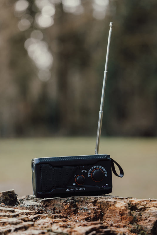 Nordic Drift Titan IPX4 multifunctional radio with 4000mAh battery, portable audio device showing control buttons and display screen