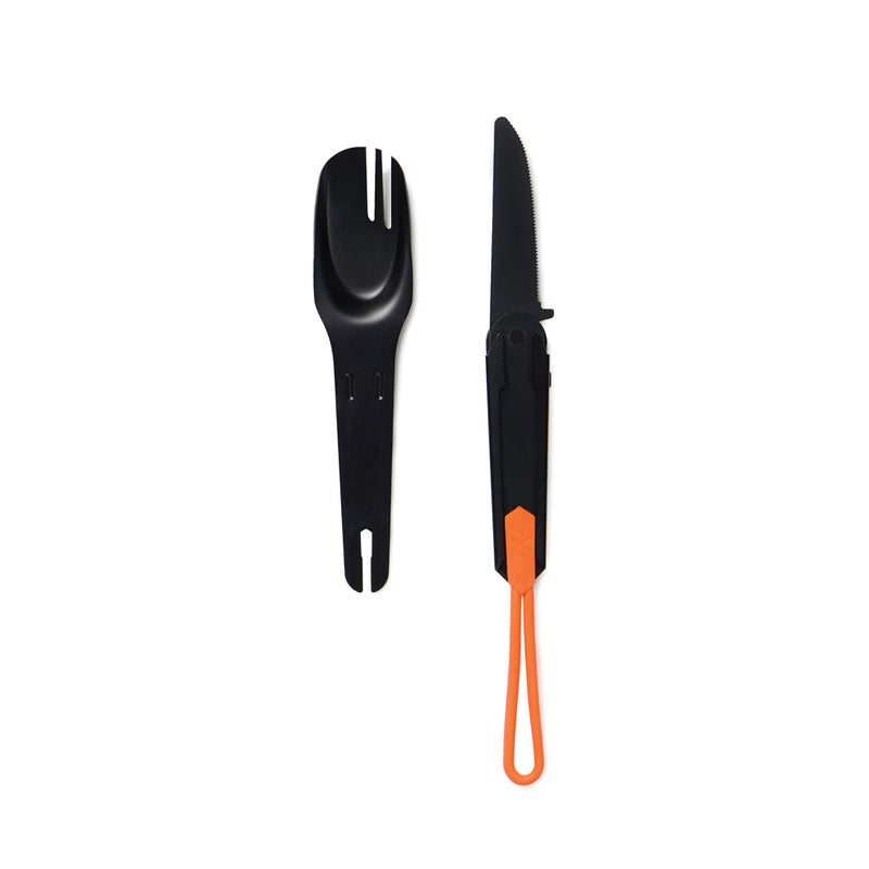 Load image into Gallery viewer, Nordic Drift Trail 4-in-1 outdoor cutlery set with fork, knife, spoon, and bottle opener on a camping table.
