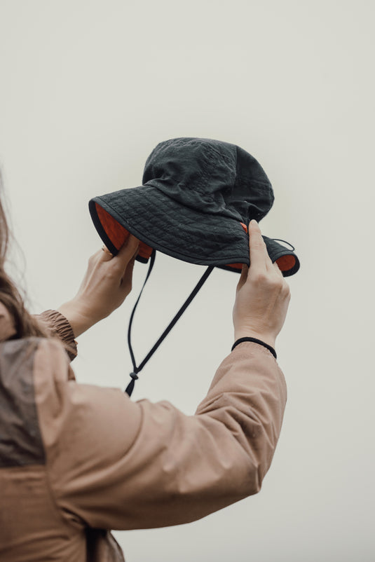 Nordic Drift RCS Horizon UPF 50+ bucket hat in neutral color, lightweight headwear with wide brim for sun protection.