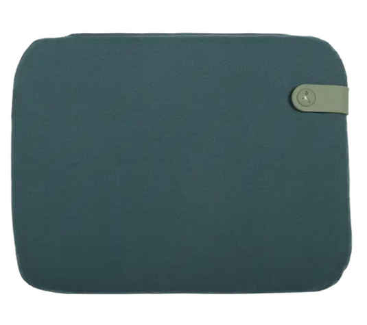 Night Blue Fermob outdoor cushion measuring 38x30cm on burgundy chair seat pad for patio or garden seating.