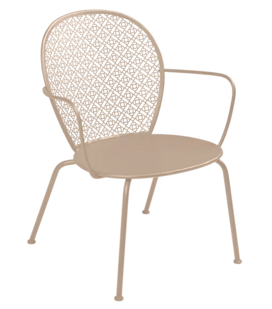 Nutmeg Fermob Lorette low armchair with a metal frame, outdoor-friendly design, featuring a stylish, modern look for outdoor seating.