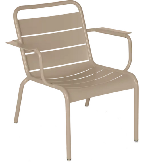 Fermob Luxembourg garden armchair lounge in nutmeg color, outdoor lounge chair with curved armrests and woven seat design.