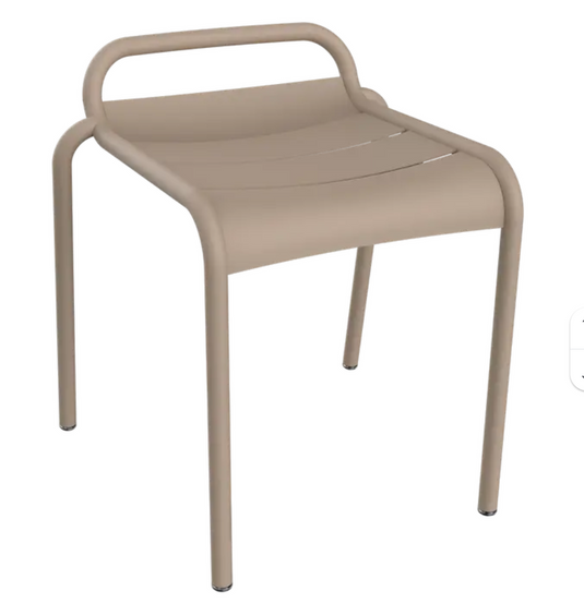 Nutmeg Fermob Luxembourg outdoor stool with a sleek, rounded design for patio or garden seating.