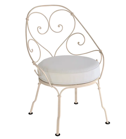 Nutmeg and off-white Fermob Cabriolet outdoor armchair with metal frame, stylish and comfortable for garden or patio seating.