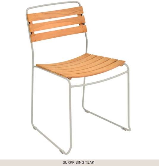 White Fermob outdoor metal chair with a surprising teak seat, ideal for stylish outdoor furniture.