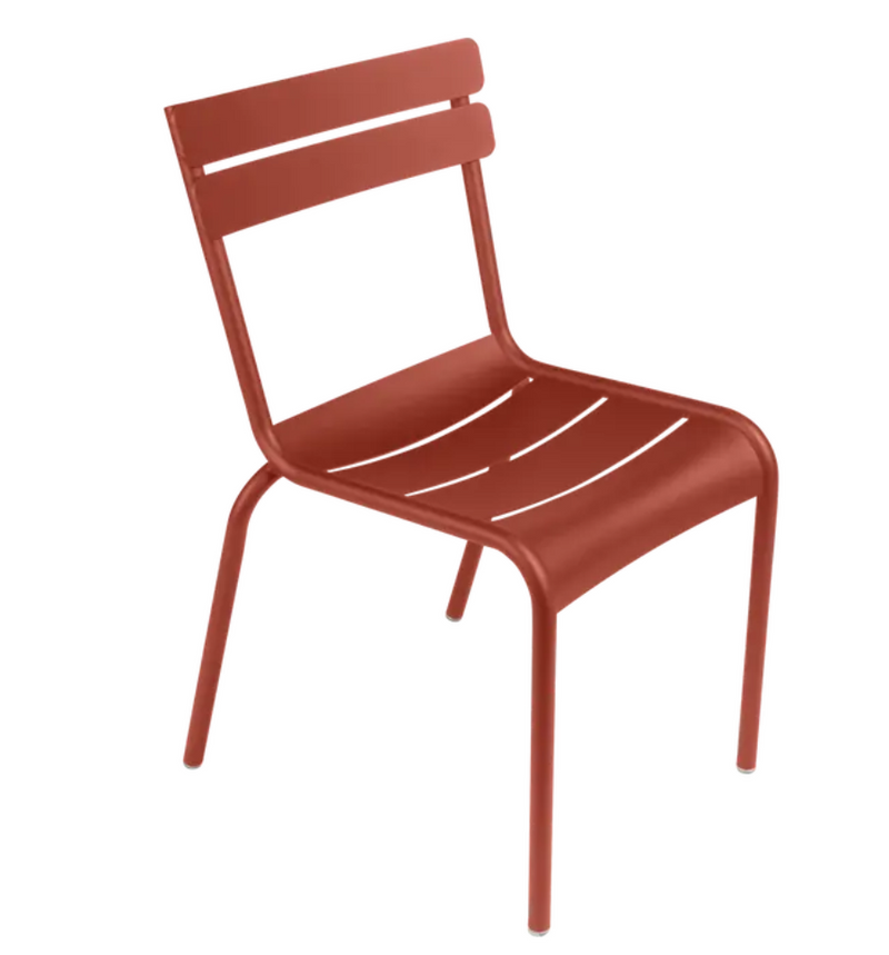 Load image into Gallery viewer, Fermob Luxembourg armchair in ochre yellow, metal frame, stackable design, suitable for outdoor and restaurant settings.
