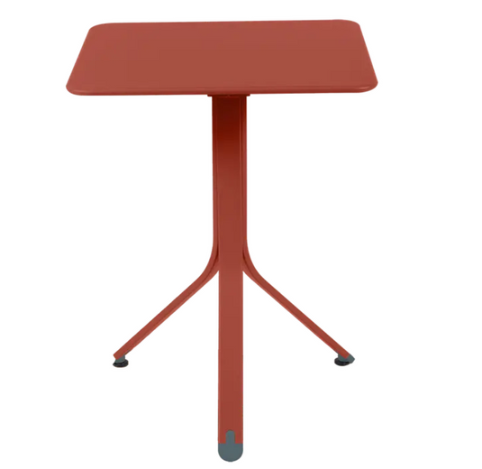 Fermob Rest'O folding outdoor table in metal with 57x57cm top, shown outdoors in Ireland setting.