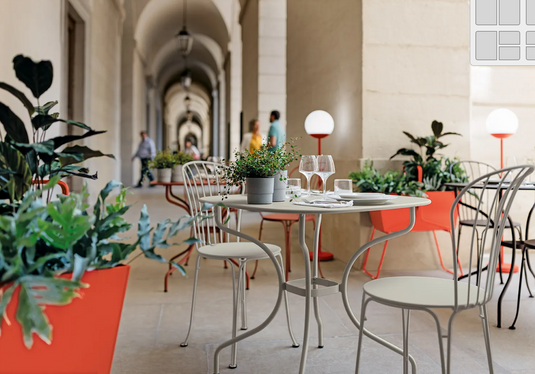 Fermob OPÉRA+ metal outdoor chair with a sleek design, suitable for restaurant or patio seating in Ireland.