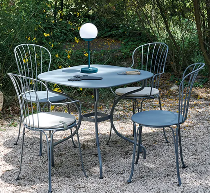 Load image into Gallery viewer, Fermob OPÉRA+ metal outdoor chair with curved back and armrests, designed for stylish outdoor seating.
