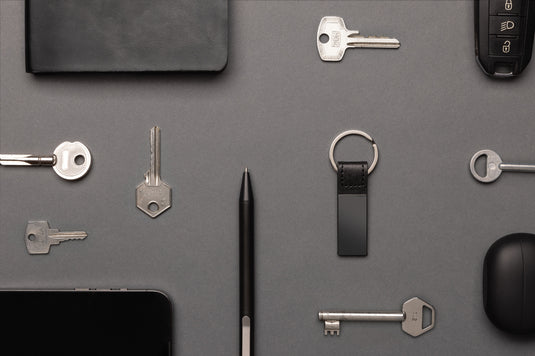 Luxury PU keychain by XD Collection with recycled zinc alloy, featuring a sleek design and durable lanyard attachment.
